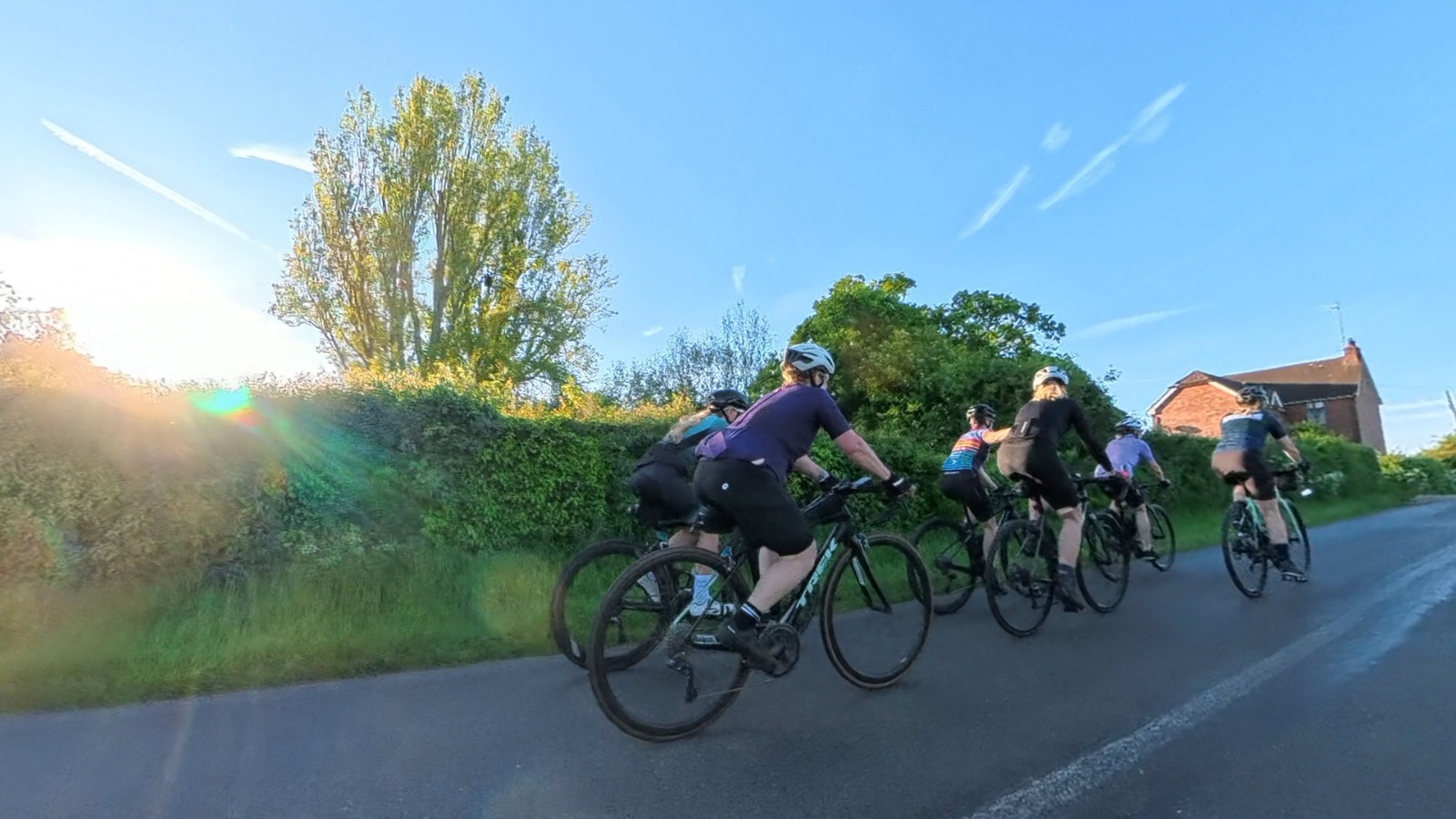 A group of women riding bikes in the countryside